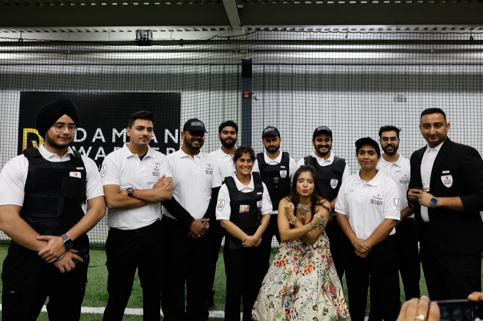 Accure Security team standing together at a formal indoor event.