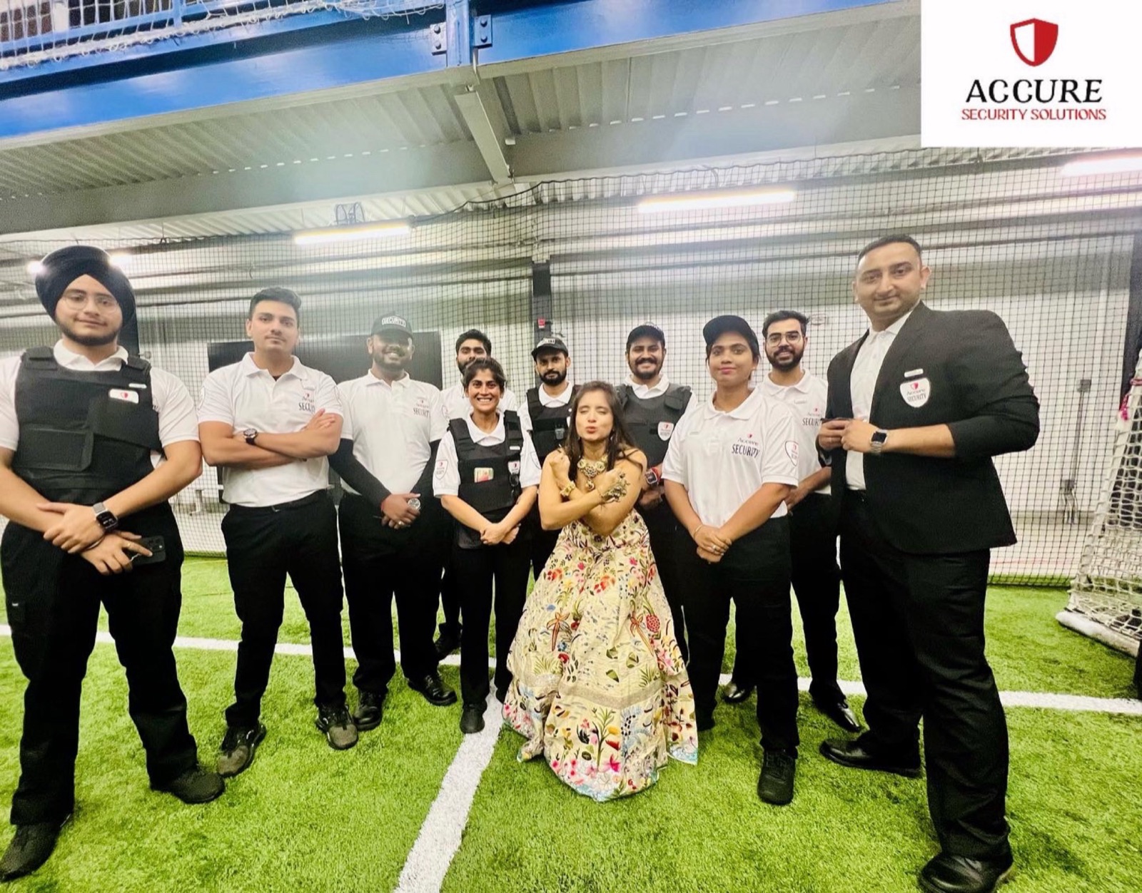 Accure Security group gathered for field briefing at a venue.